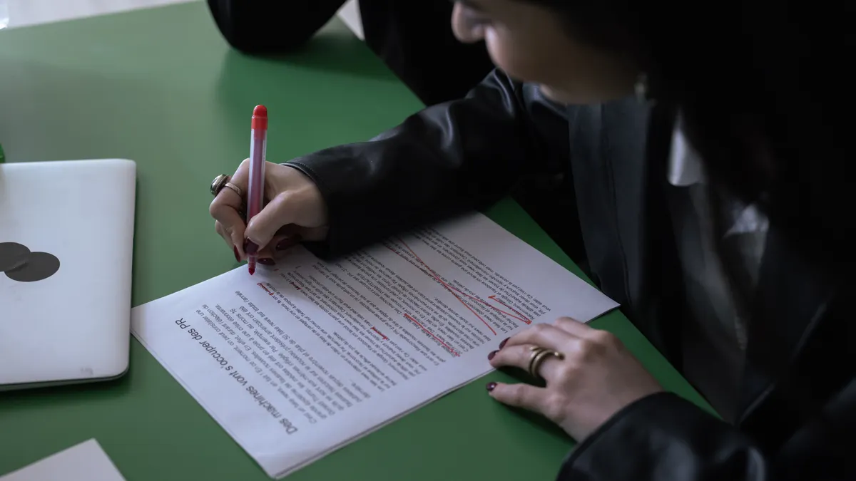 Grammar checker vs AI writer: which tool solves which problem Grammar checker vs AI writer: which tool solves which problem — A Person in Black Long Sleeve Shirt Writing on White Pap