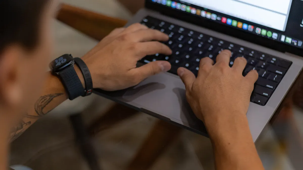 How to choose writing software for solo creators versus teams — Man Writing on a Laptop