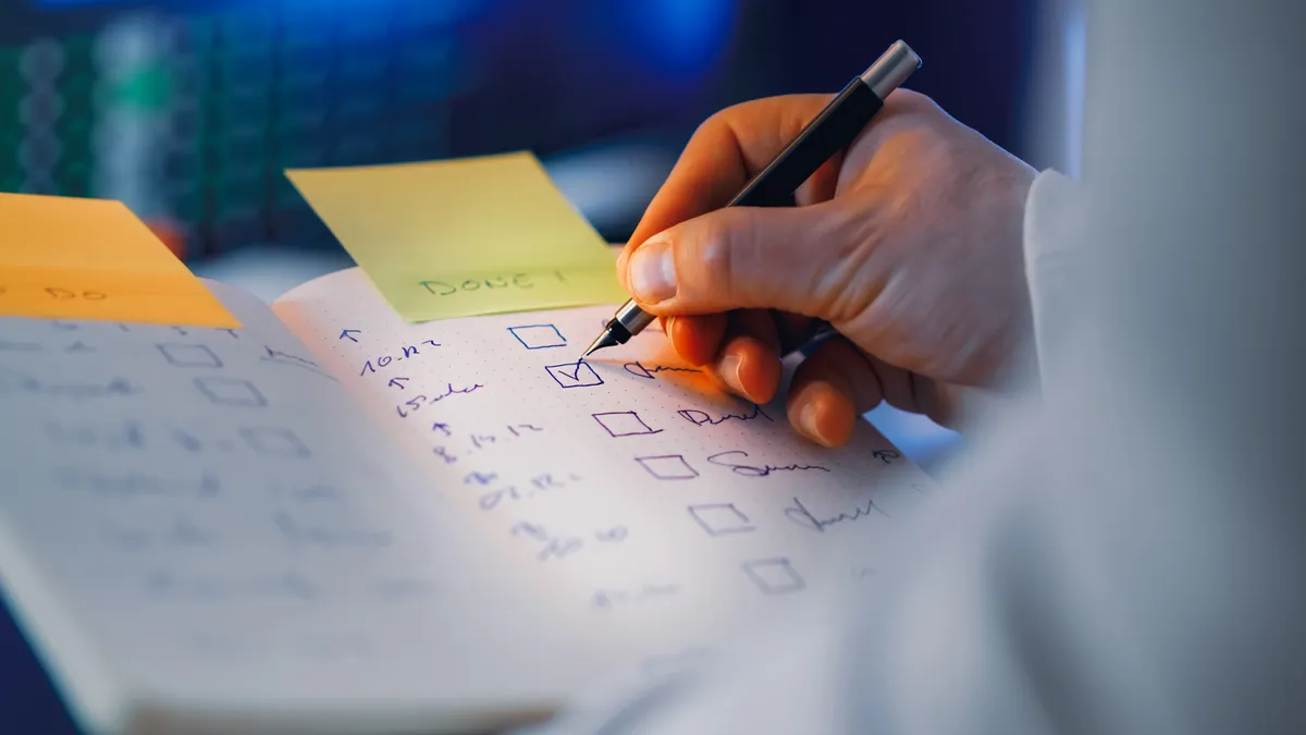 How to evaluate a writing SaaS trial before you commit How to evaluate a writing SaaS trial before you commit — Hand Writing in Notebook with Checklist in Focus