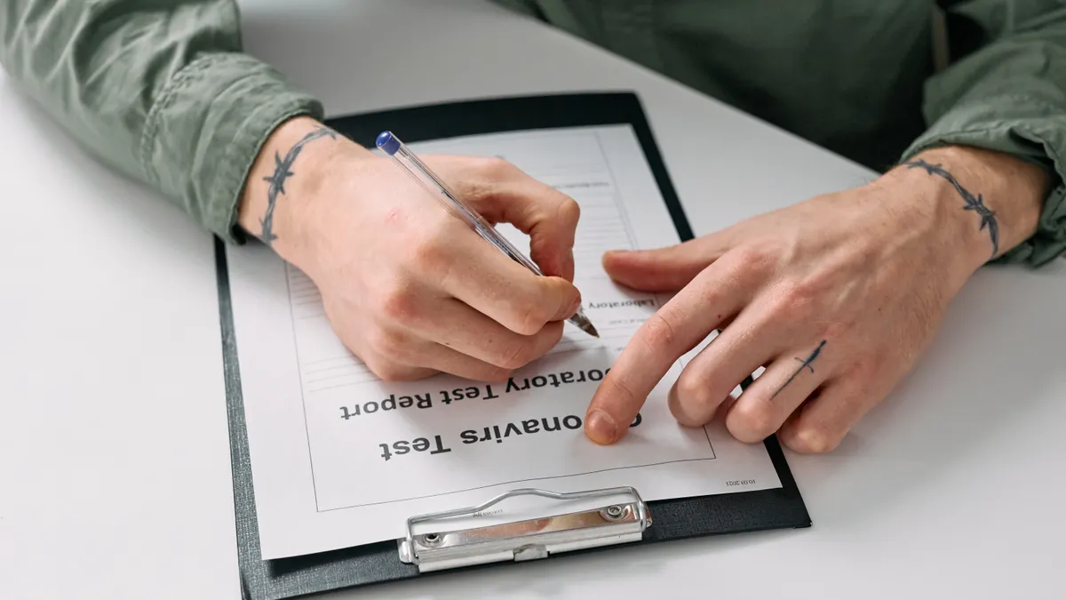 How to evaluate a writing SaaS trial before you commit How to evaluate a writing SaaS trial before you commit — Tattoos on Hands of Man Writing on Notepad