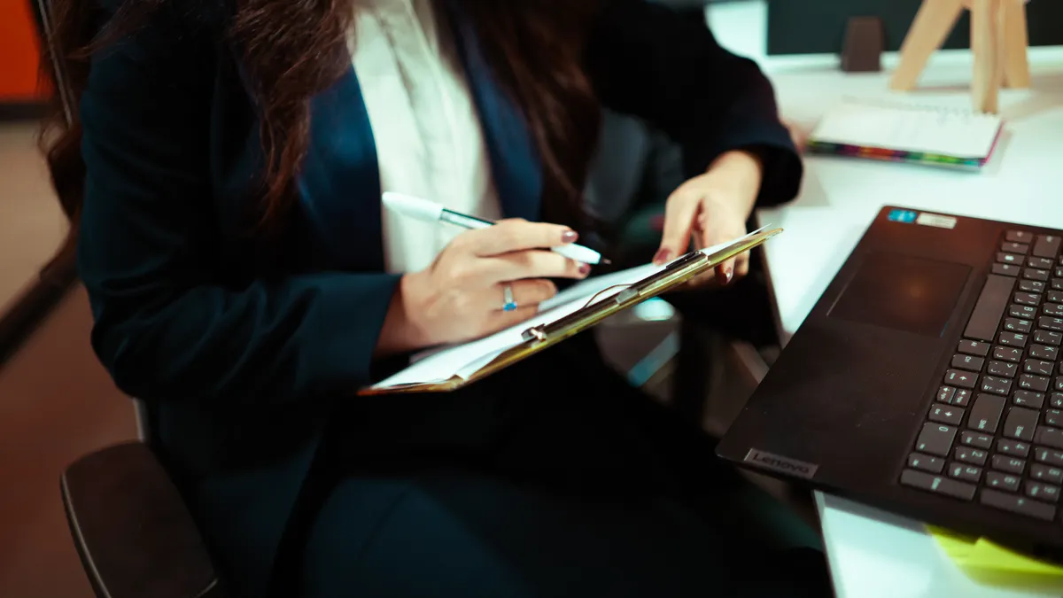 How to set up a writing workflow in SaaS tools from idea to publish How to set up a writing workflow in SaaS tools from idea to publish — Businesswoman Writing in Office Setting