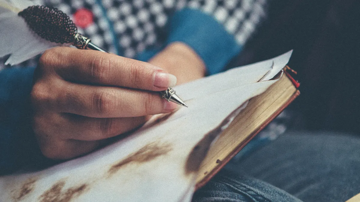 What is writing SaaS? A plain-English definition and examples What is writing SaaS? A plain-English definition and examples — Person WritIng On Paper