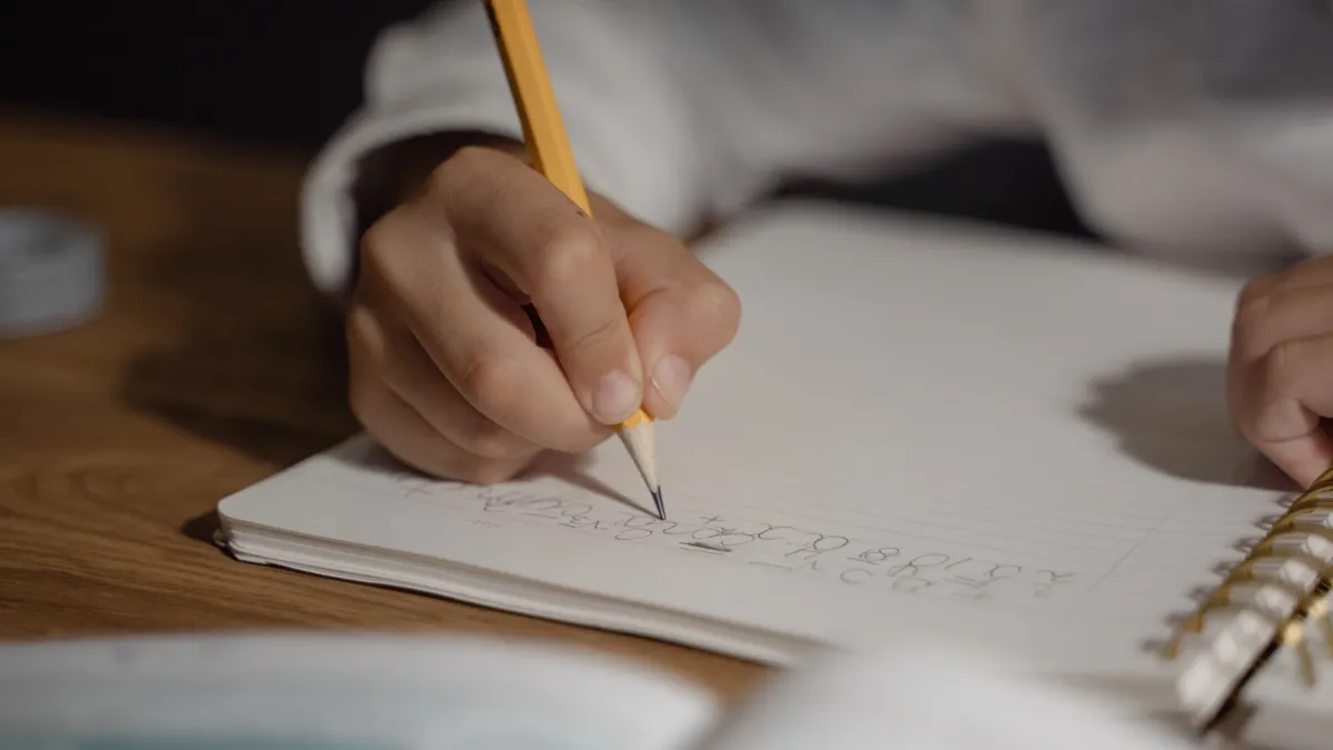 What is writing SaaS? A plain-English definition and examples What is writing SaaS? A plain-English definition and examples — A Person Writing on a Notebook