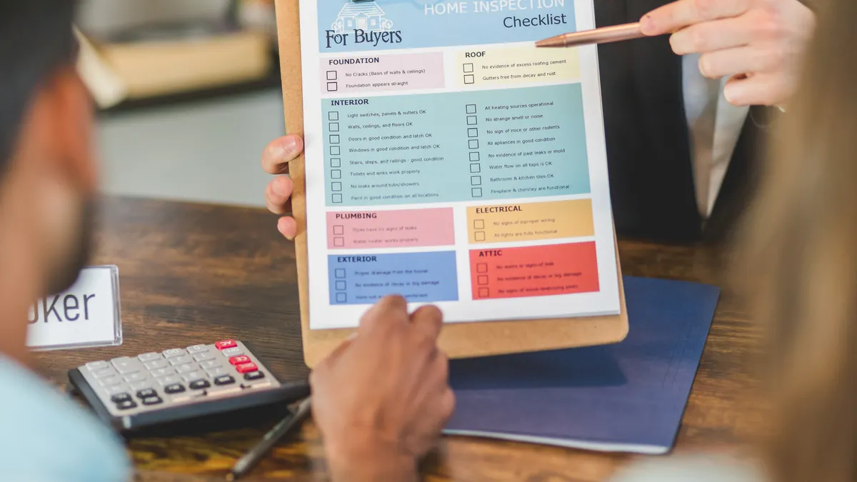 Writing SaaS buyer decision hub — The Complete Guide two people reviewing a buyer checklist