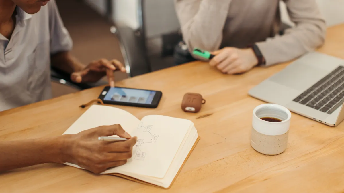 Writing tools for teams: what features matter for collaboration Writing tools for teams: what features matter for collaboration — A Person Writing on the Notebook